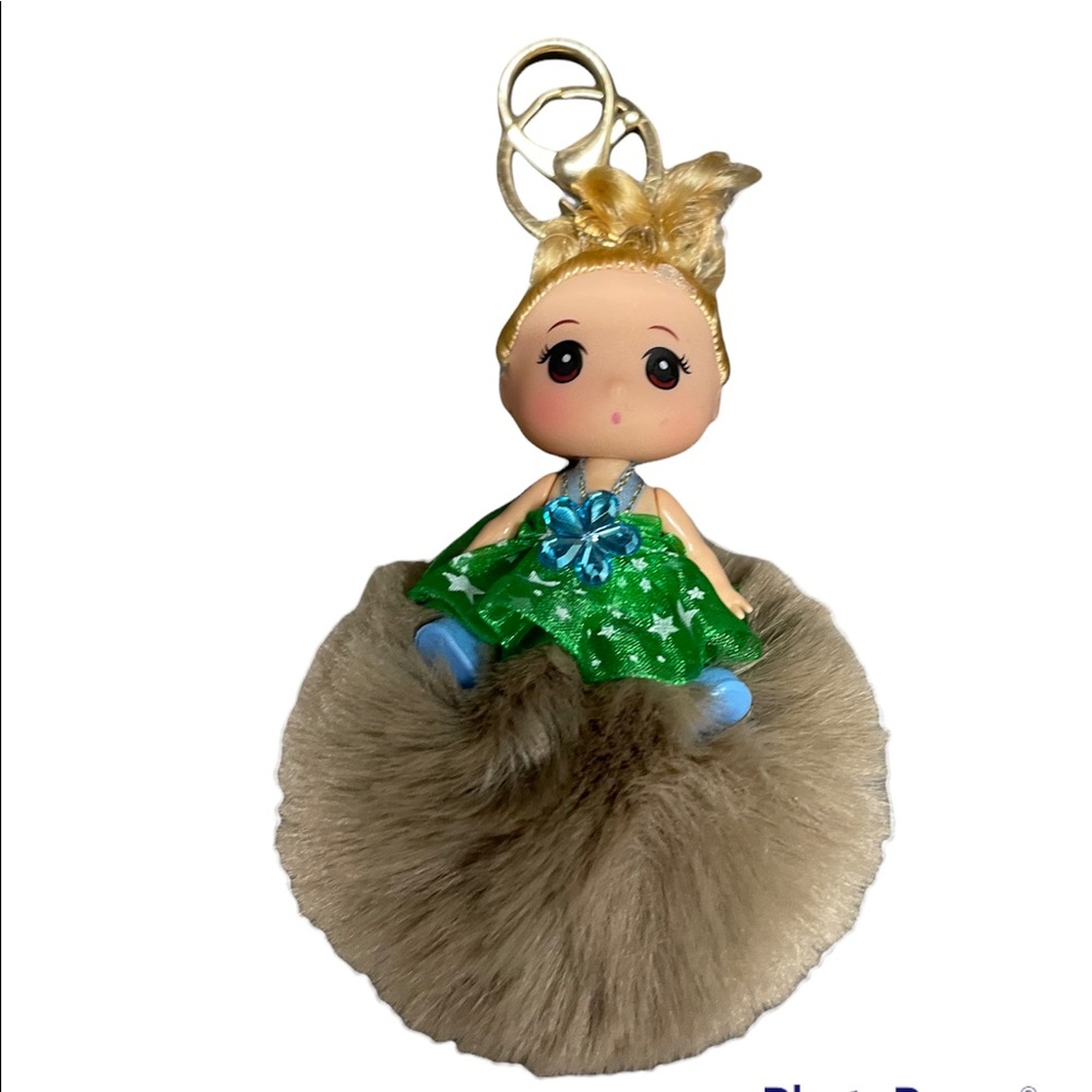 Super cute Pom Pom keychain with doll on top